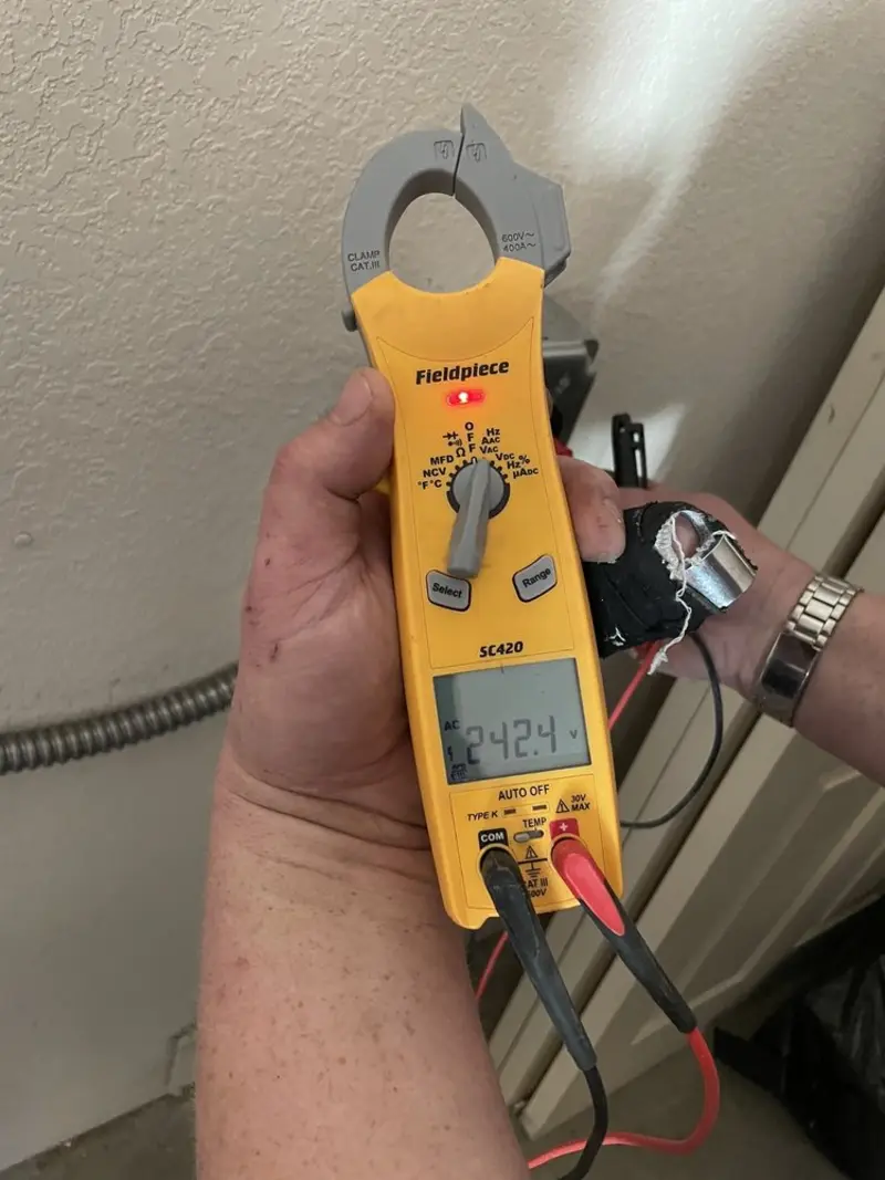 Voltage testing with clamp meter during Generator Installation in San Mateo